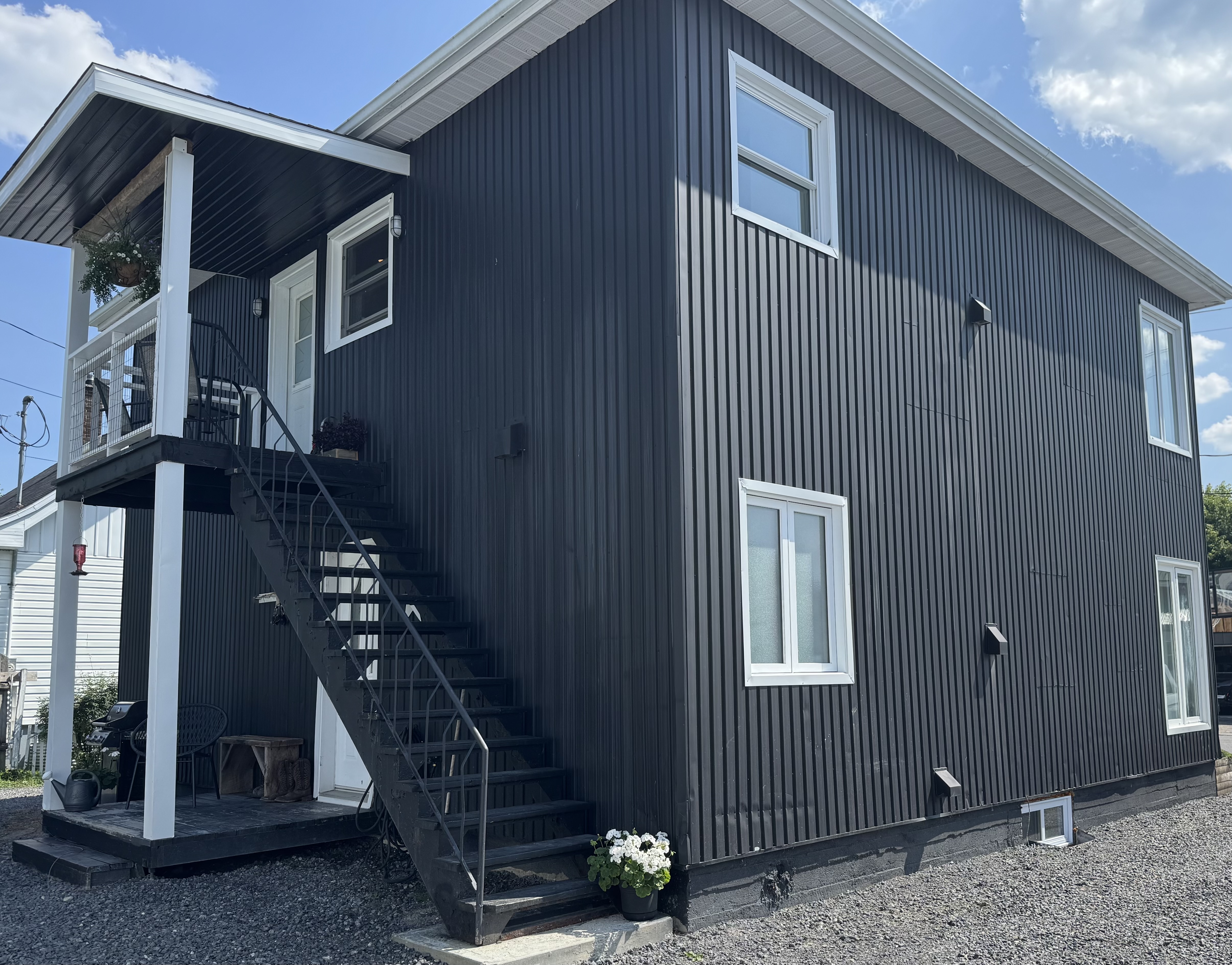 The exterior of Le Duplex Nordik in the boreal forest