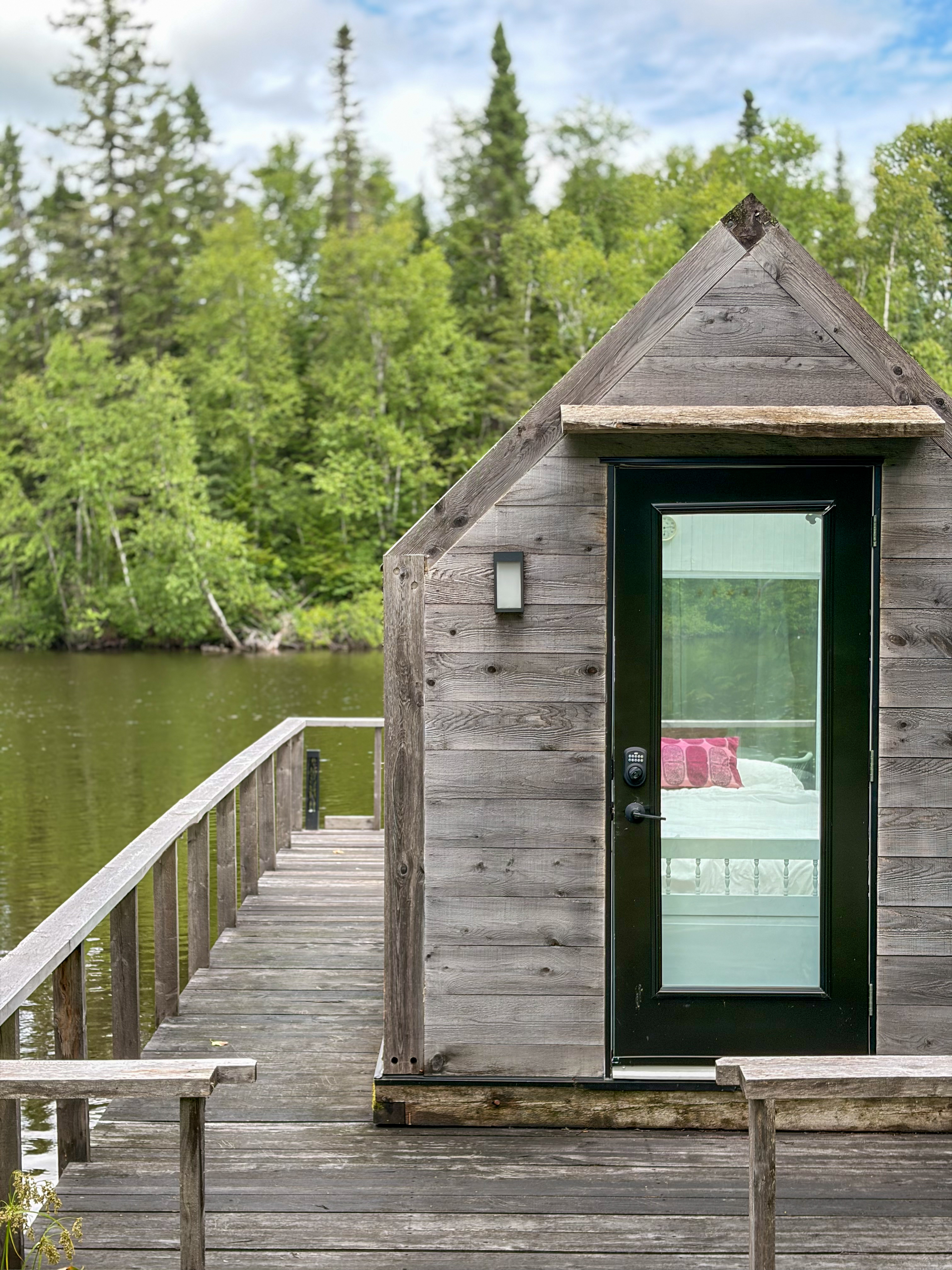 La Maison de Verre at the end of its dock on Lac des Chicots