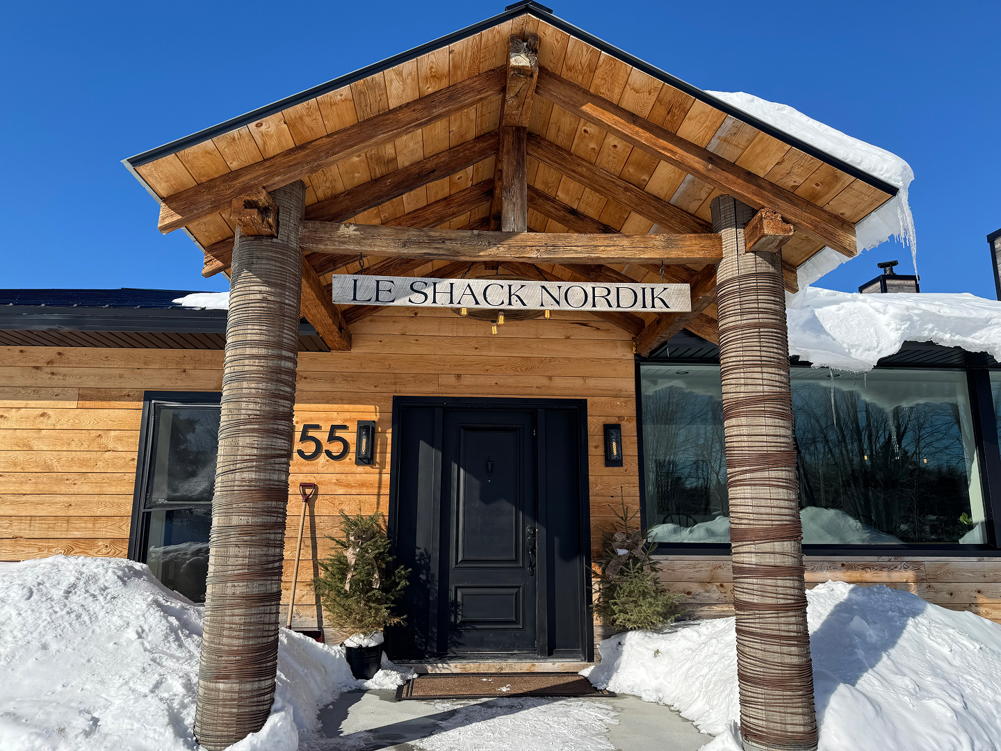 The entrance to Le Shack Nordik in the snow