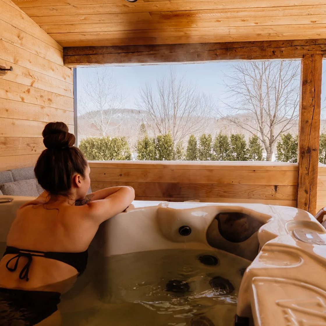 Relaxing in the hot tub with a view of the lake