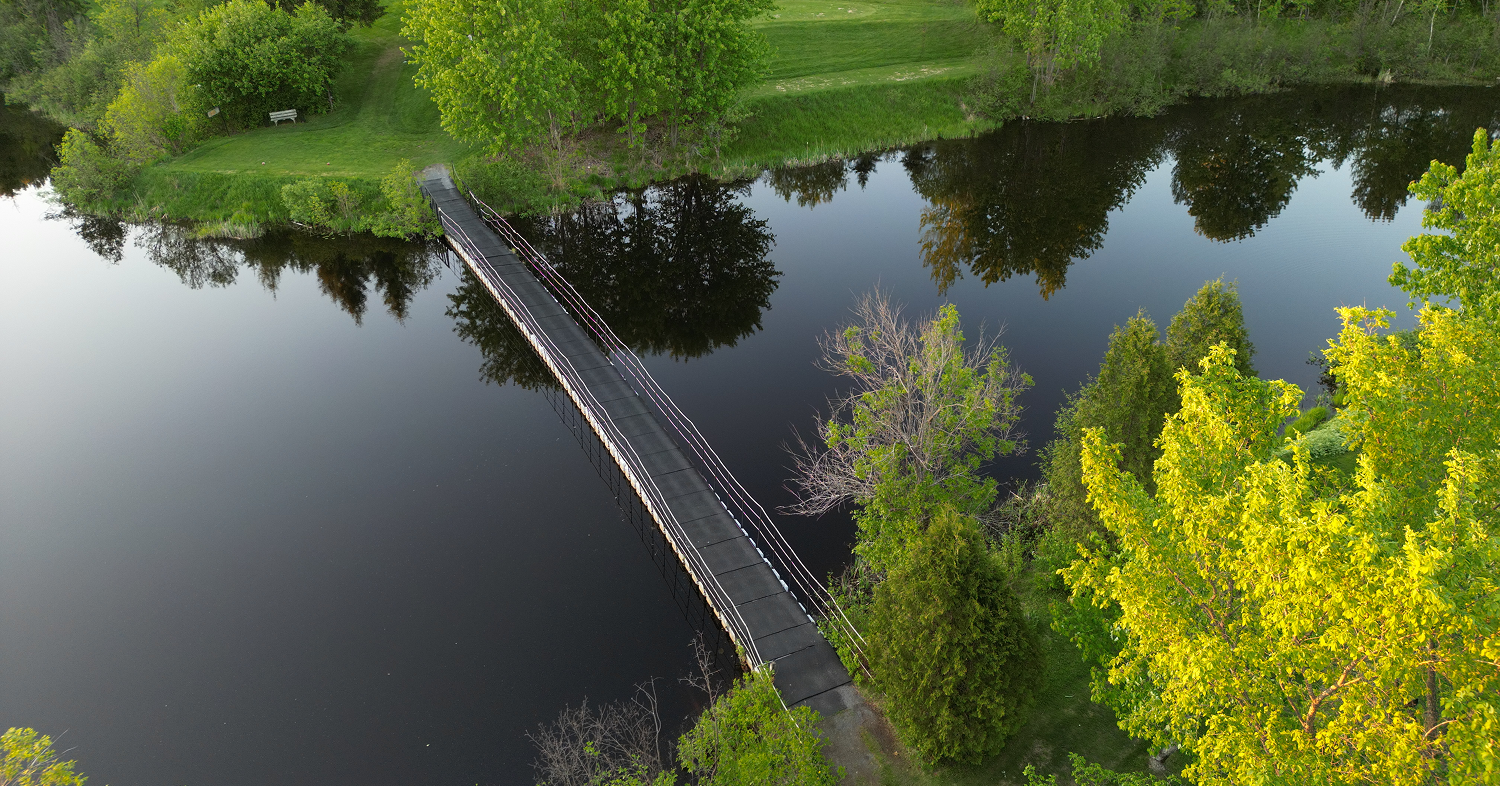 An aerial view of the footbridge crossing the lake