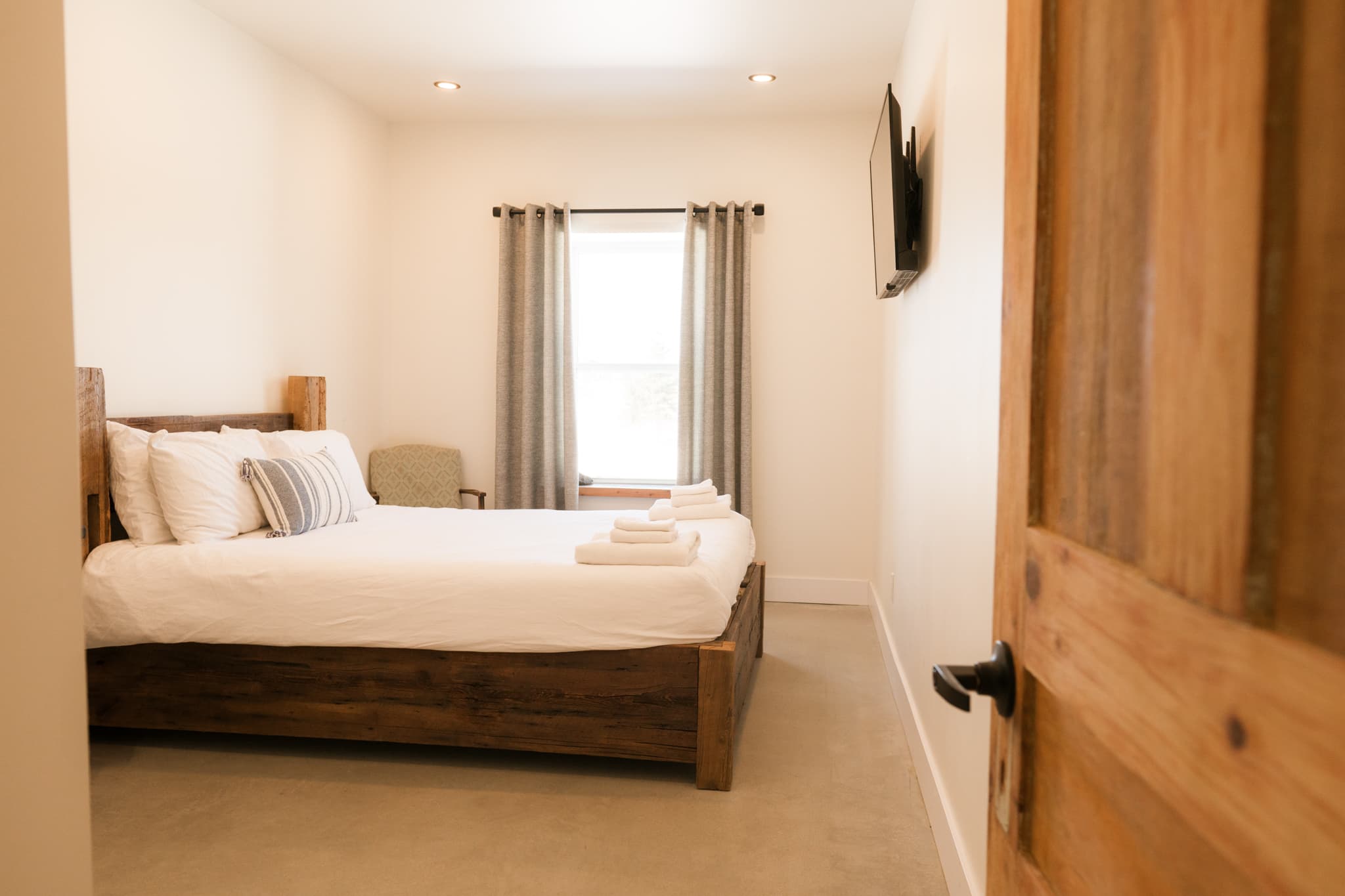 A bright bedroom with a double bed